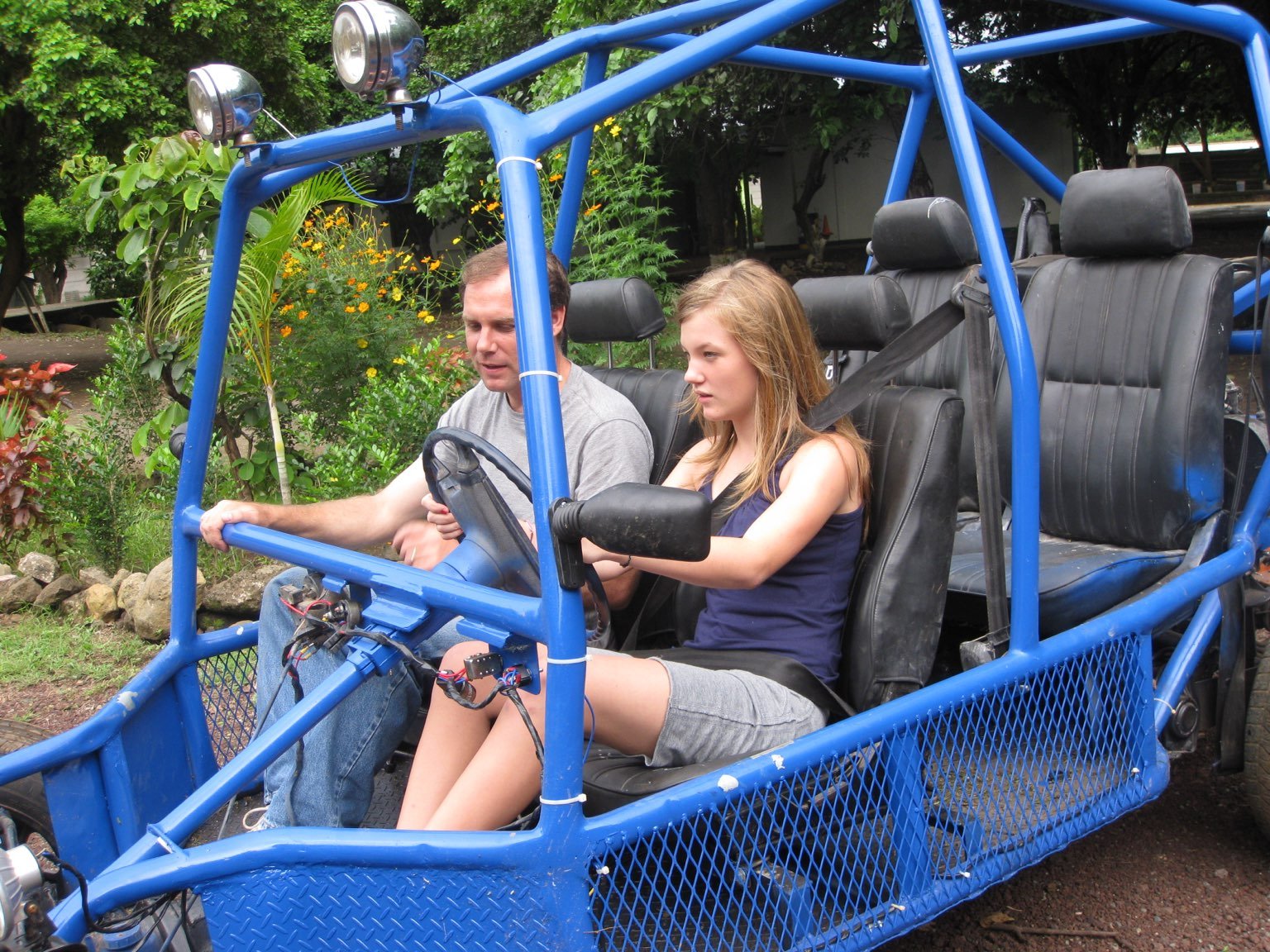 A young girl trying to drive.